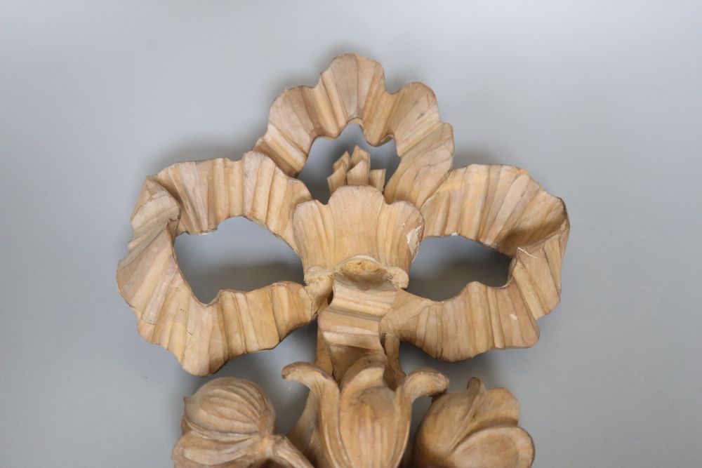 A carved beech ribbon and fruit wall applique, length 47cm